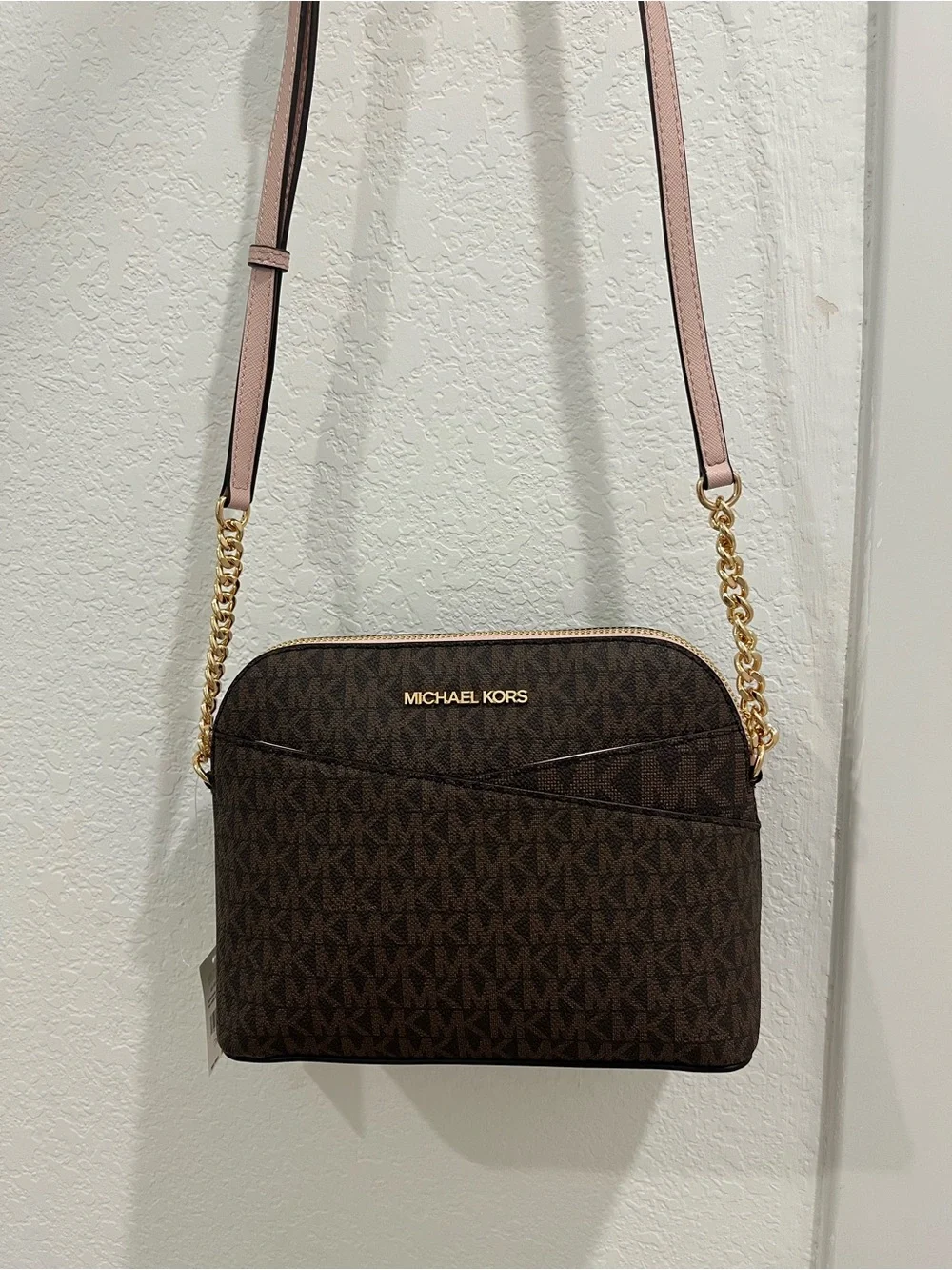 Michael Kors Brown Monogram Crossbody with Pink Trim and Gold Chain Brand new .